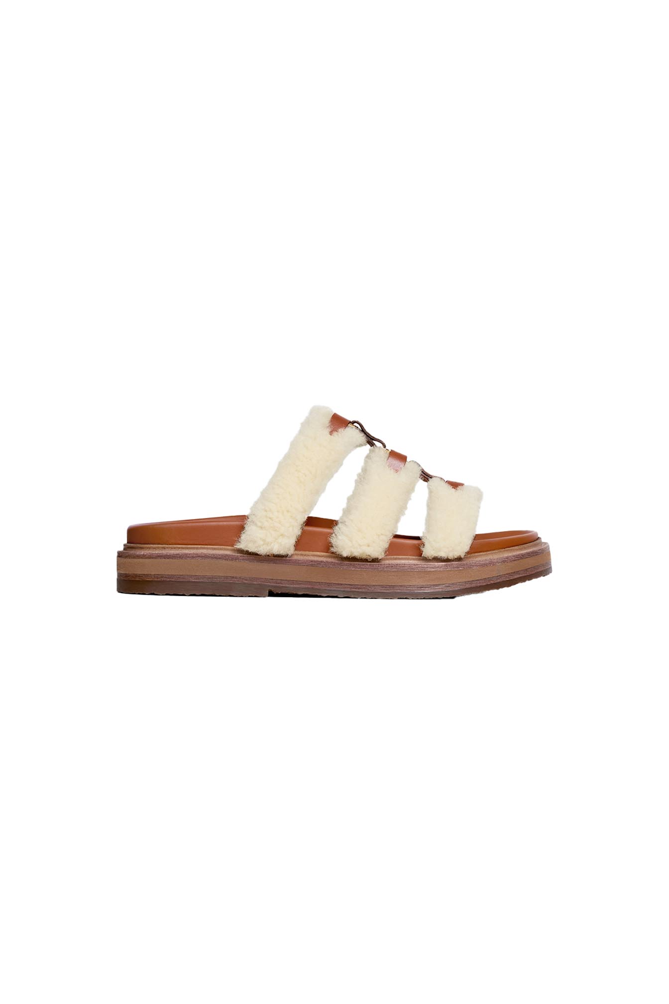 celine_0003_CETTRM-TAN-TIPPI-SLIDES-IN-SHEARLING-AND-CALFSKIN-TAN-_-NATURAL-